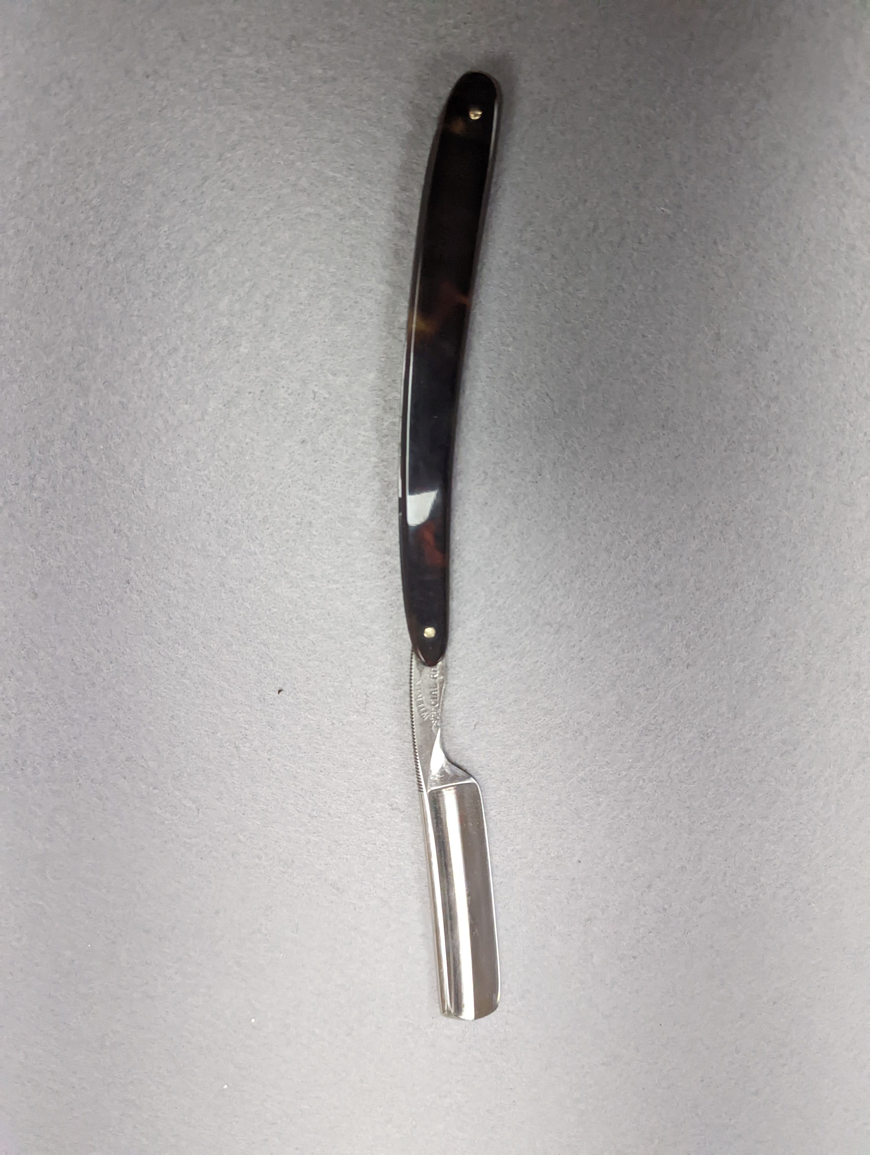 A set of seven tortoiseshell handled cut throat razors for the days of the week Wilkinson and a cased pair of tortoiseshell handled razors, C&W Higginbottom